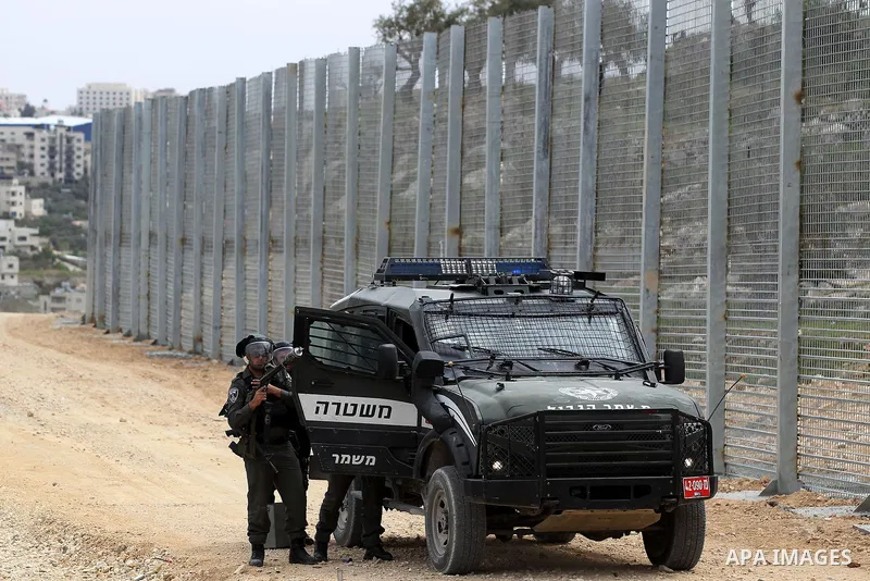 Israeli border policemen fire a tear gas canister towards Palestinian demonstrators during clashes at a protest marking Land Day, in the West Bank city of Beit Jala March 30, 2017. March 30 marks Land Day, the annual com...
