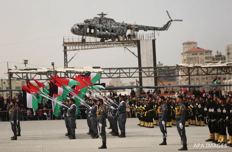 Palestinian police officers loyal to Hamas take part in a graduation ceremony in Gaza City March 30, 2017. Photo by Ashraf Amra
