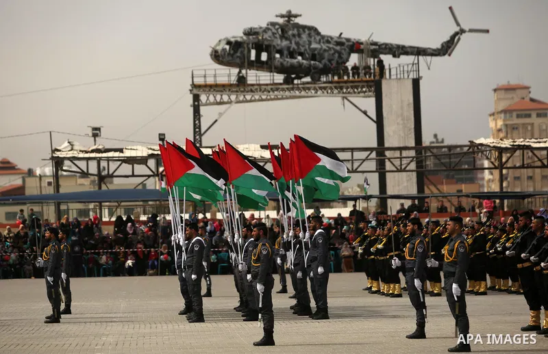 Palestinian police officers loyal to Hamas take part in a graduation ceremony in Gaza City March 30, 2017. Photo by Ashraf Amra