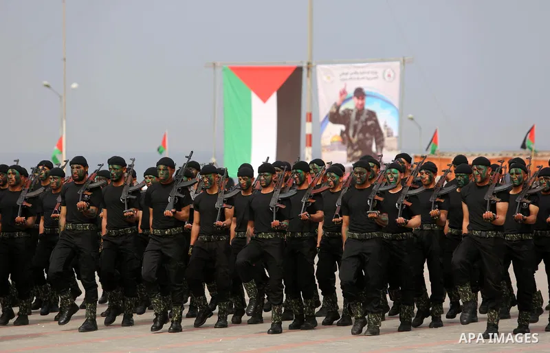 Palestinian police officers loyal to Hamas take part in a graduation ceremony in Gaza City March 30, 2017. Photo by Ashraf Amra