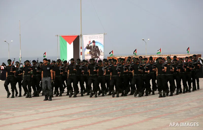Palestinian police officers loyal to Hamas take part in a graduation ceremony in Gaza City March 30, 2017. Photo by Ashraf Amra