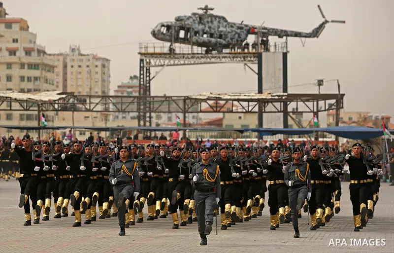 Palestinian police officers loyal to Hamas take part in a graduation ceremony in Gaza City March 30, 2017. Photo by Ashraf Amra