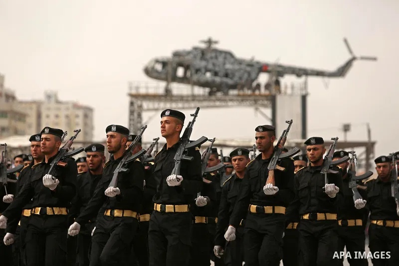 Palestinian police officers loyal to Hamas take part in a graduation ceremony in Gaza City March 30, 2017. Photo by Ashraf Amra