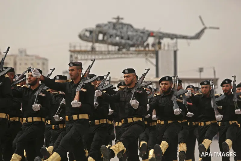 Palestinian police officers loyal to Hamas take part in a graduation ceremony in Gaza City March 30, 2017. Photo by Ashraf Amra