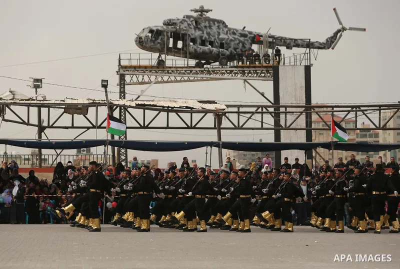 Palestinian police officers loyal to Hamas take part in a graduation ceremony in Gaza City March 30, 2017. Photo by Ashraf Amra