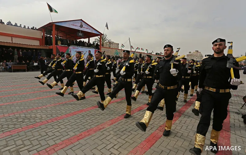 Palestinian police officers loyal to Hamas take part in a graduation ceremony in Gaza City March 30, 2017. Photo by Ashraf Amra