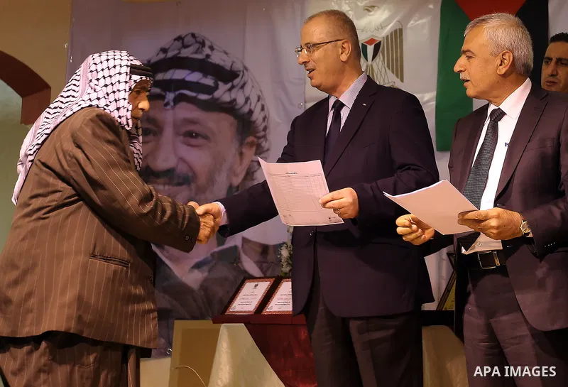 Palestinian Prime Minister Rami al-Hamdallah attends the completion ceremony of the land settlement project of Abu Falah village in the West Bank city of Ramallah on March 30, 2017. Photo by Prime Minister Office