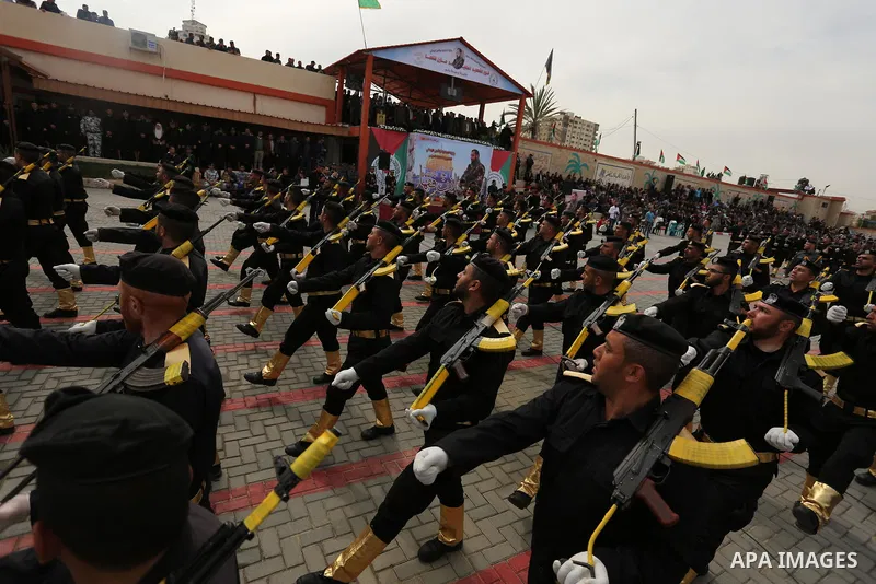 Palestinian police officers loyal to Hamas take part in a graduation ceremony in Gaza City March 30, 2017. Photo by Ashraf Amra
