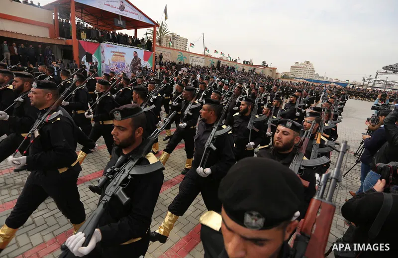 Palestinian police officers loyal to Hamas take part in a graduation ceremony in Gaza City March 30, 2017. Photo by Ashraf Amra