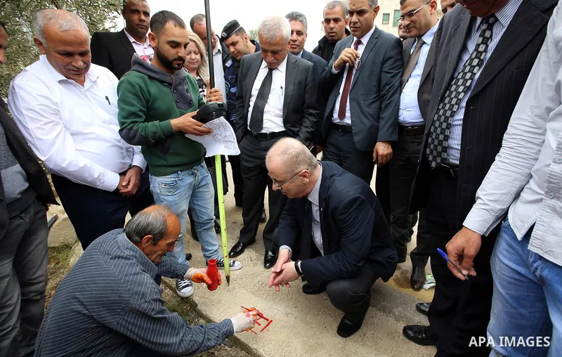 Palestinian Prime Minister Rami al-Hamdallah attends the completion ceremony of the land settlement project of Abu Falah village in the West Bank city of Ramallah on March 30, 2017. Photo by Prime Minister Office