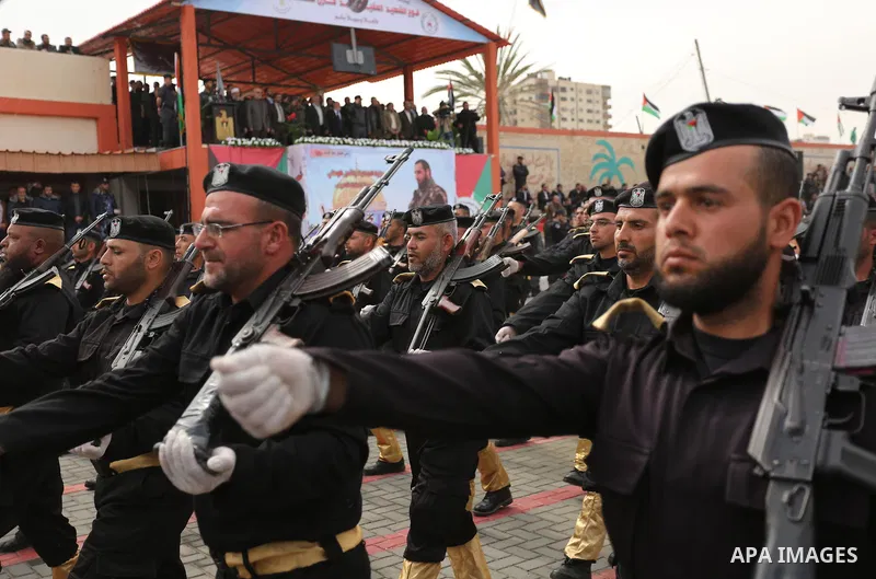Palestinian police officers loyal to Hamas take part in a graduation ceremony in Gaza City March 30, 2017. Photo by Ashraf Amra