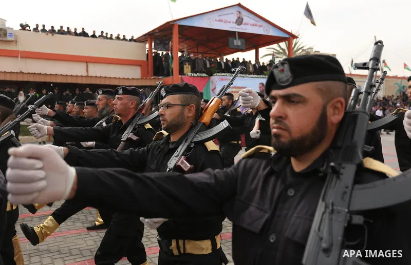 Palestinian police officers loyal to Hamas take part in a graduation ceremony in Gaza City March 30, 2017. Photo by Ashraf Amra