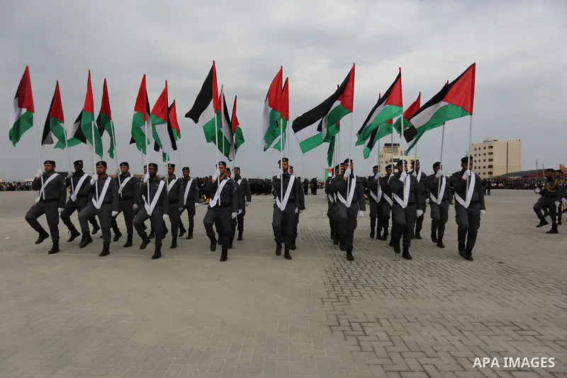 Palestinian police officers loyal to Hamas take part in a graduation ceremony in Gaza City March 30, 2017. Photo by Ashraf Amra