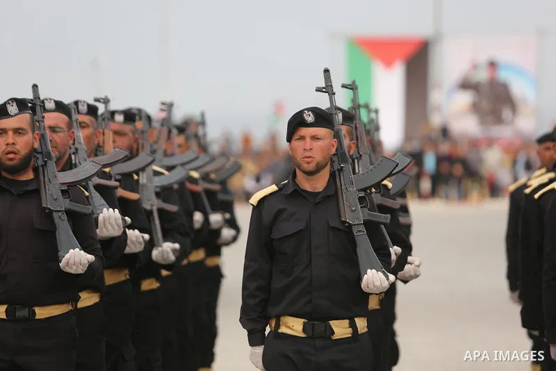 Palestinian police officers loyal to Hamas take part in a graduation ceremony in Gaza City March 30, 2017. Photo by Ashraf Amra