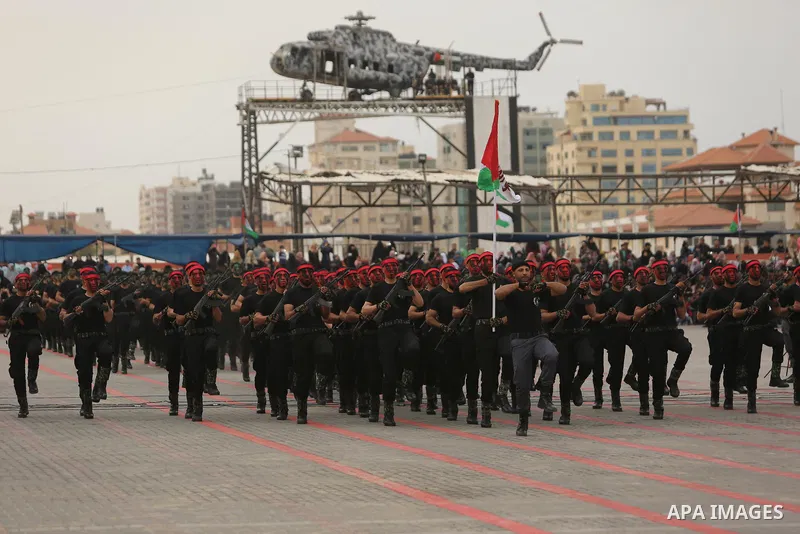 Palestinian police officers loyal to Hamas take part in a graduation ceremony in Gaza City March 30, 2017. Photo by Ashraf Amra