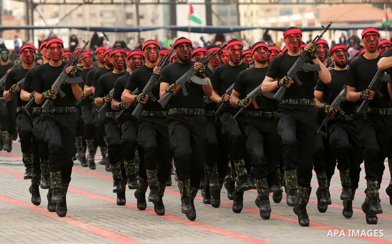 Palestinian police officers loyal to Hamas take part in a graduation ceremony in Gaza City March 30, 2017. Photo by Ashraf Amra