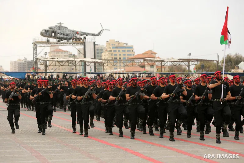 Palestinian police officers loyal to Hamas take part in a graduation ceremony in Gaza City March 30, 2017. Photo by Ashraf Amra