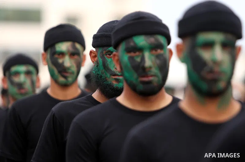Palestinian police officers loyal to Hamas take part in a graduation ceremony in Gaza City March 30, 2017. Photo by Ashraf Amra
