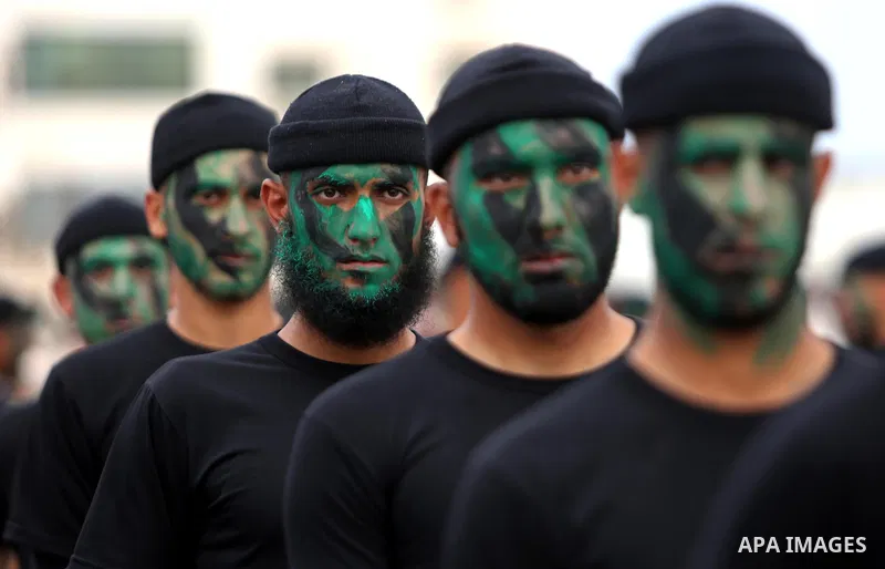 Palestinian police officers loyal to Hamas take part in a graduation ceremony in Gaza City March 30, 2017. Photo by Ashraf Amra