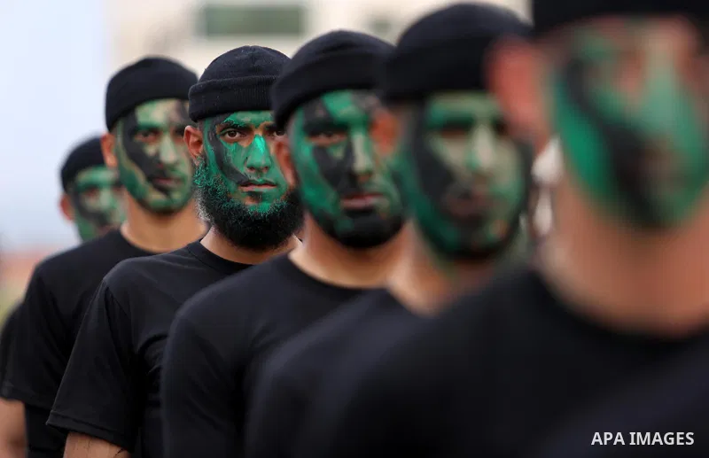 Palestinian police officers loyal to Hamas take part in a graduation ceremony in Gaza City March 30, 2017. Photo by Ashraf Amra