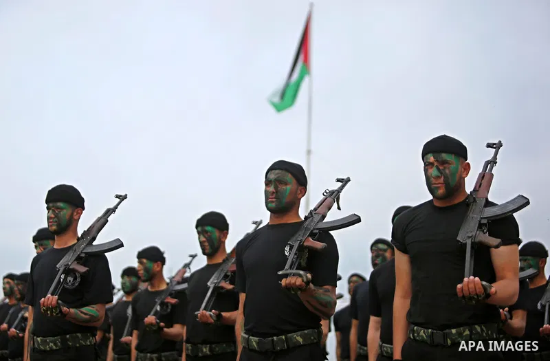 Palestinian police officers loyal to Hamas take part in a graduation ceremony in Gaza City March 30, 2017. Photo by Ashraf Amra