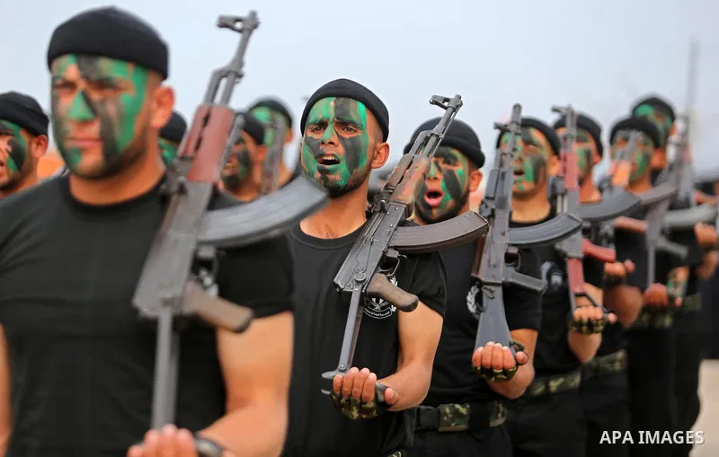 Palestinian police officers loyal to Hamas take part in a graduation ceremony in Gaza City March 30, 2017. Photo by Ashraf Amra