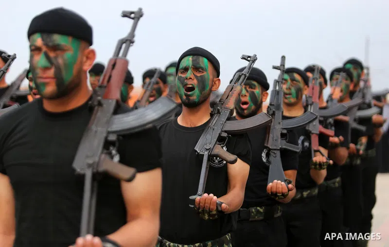 Palestinian police officers loyal to Hamas take part in a graduation ceremony in Gaza City March 30, 2017. Photo by Ashraf Amra