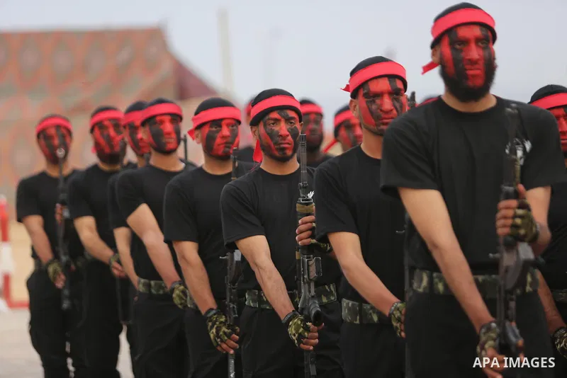 Palestinian police officers loyal to Hamas take part in a graduation ceremony in Gaza City March 30, 2017. Photo by Ashraf Amra