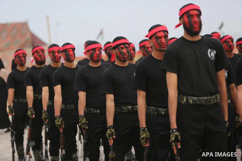 Palestinian police officers loyal to Hamas take part in a graduation ceremony in Gaza City March 30, 2017. Photo by Ashraf Amra