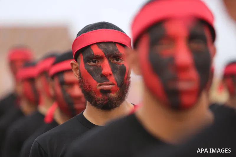 Palestinian police officers loyal to Hamas take part in a graduation ceremony in Gaza City March 30, 2017. Photo by Ashraf Amra