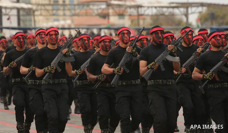 Palestinian police officers loyal to Hamas take part in a graduation ceremony in Gaza City March 30, 2017. Photo by Ashraf Amra