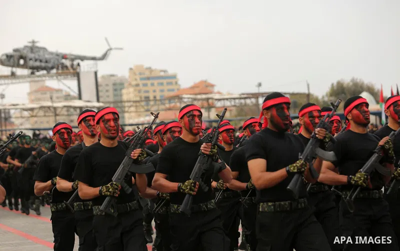 Palestinian police officers loyal to Hamas take part in a graduation ceremony in Gaza City March 30, 2017. Photo by Ashraf Amra