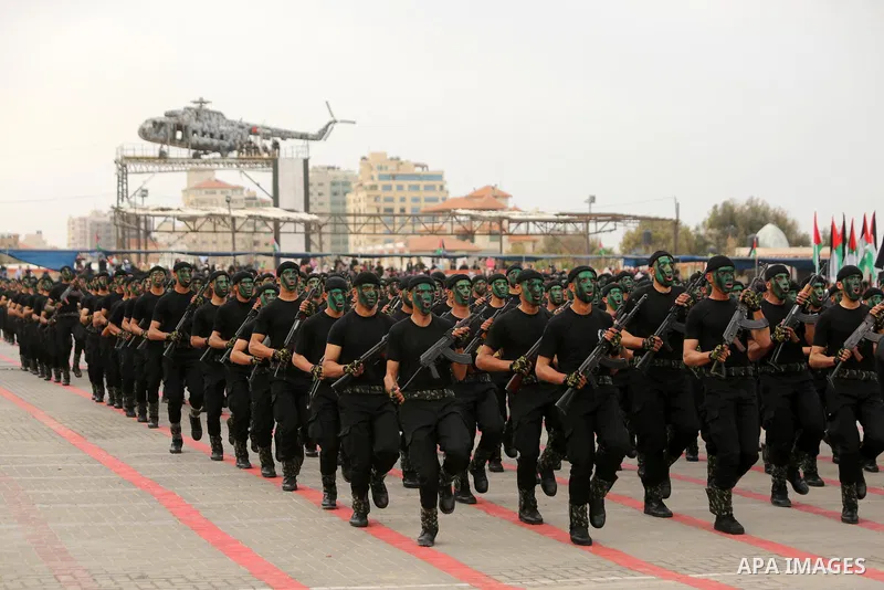Palestinian police officers loyal to Hamas take part in a graduation ceremony in Gaza City March 30, 2017. Photo by Ashraf Amra
