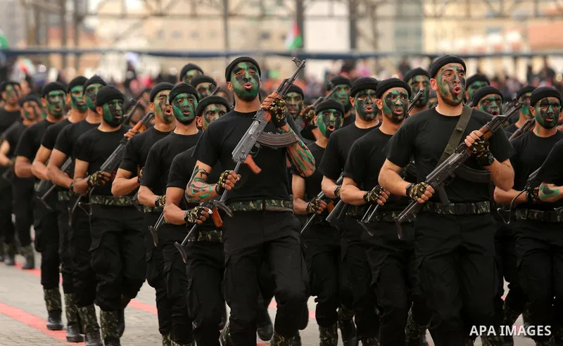Palestinian police officers loyal to Hamas take part in a graduation ceremony in Gaza City March 30, 2017. Photo by Ashraf Amra