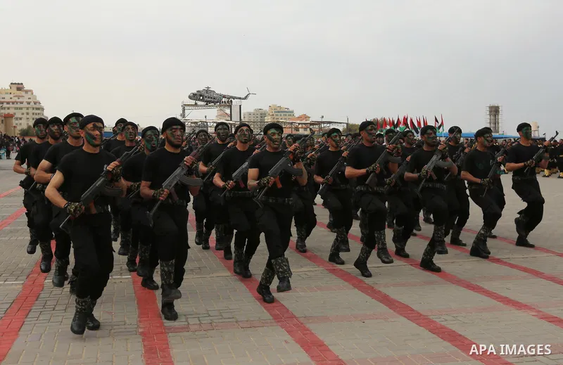 Palestinian police officers loyal to Hamas take part in a graduation ceremony in Gaza City March 30, 2017. Photo by Ashraf Amra