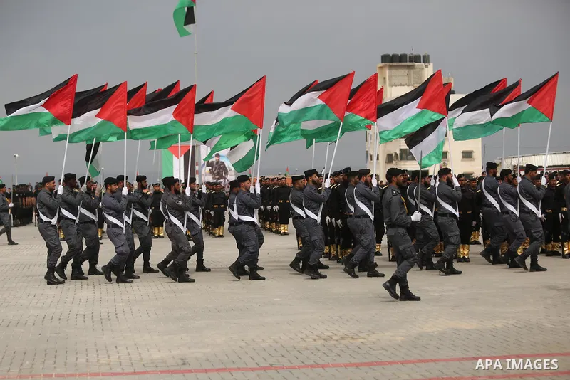 Palestinian police officers loyal to Hamas take part in a graduation ceremony in Gaza City March 30, 2017. Photo by Ashraf Amra