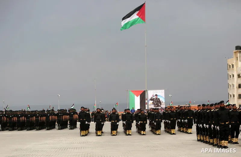 Palestinian police officers loyal to Hamas take part in a graduation ceremony in Gaza City March 30, 2017. Photo by Ashraf Amra