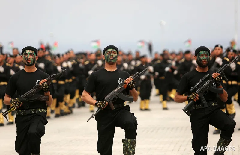 Palestinian police officers loyal to Hamas take part in a graduation ceremony in Gaza City March 30, 2017. Photo by Ashraf Amra