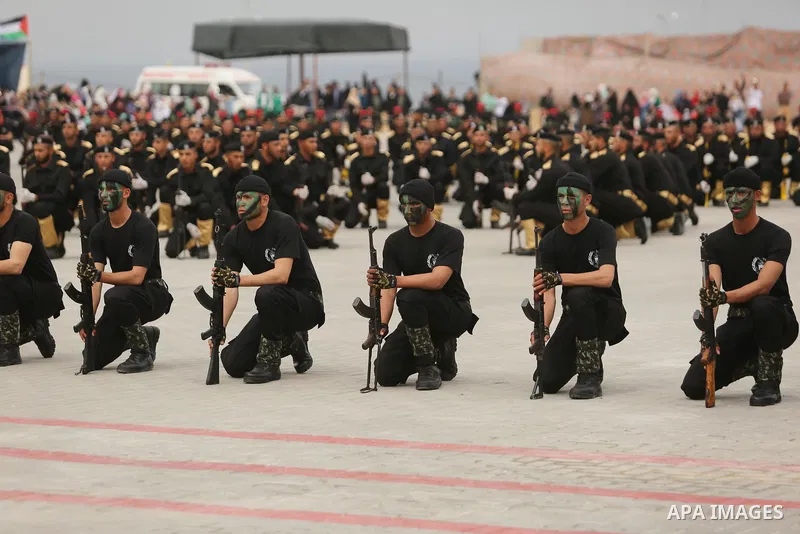 Palestinian police officers loyal to Hamas take part in a graduation ceremony in Gaza City March 30, 2017. Photo by Ashraf Amra