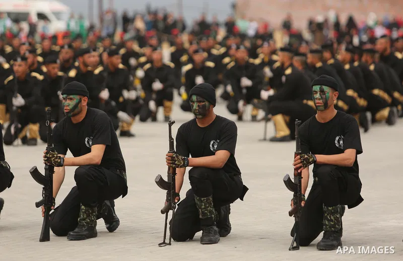 Palestinian police officers loyal to Hamas take part in a graduation ceremony in Gaza City March 30, 2017. Photo by Ashraf Amra
