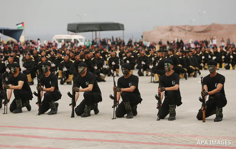 Palestinian police officers loyal to Hamas take part in a graduation ceremony in Gaza City March 30, 2017. Photo by Ashraf Amra