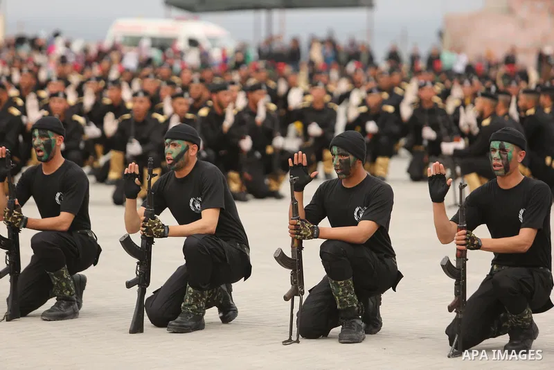 Palestinian police officers loyal to Hamas take part in a graduation ceremony in Gaza City March 30, 2017. Photo by Ashraf Amra