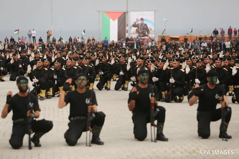 Palestinian police officers loyal to Hamas take part in a graduation ceremony in Gaza City March 30, 2017. Photo by Ashraf Amra