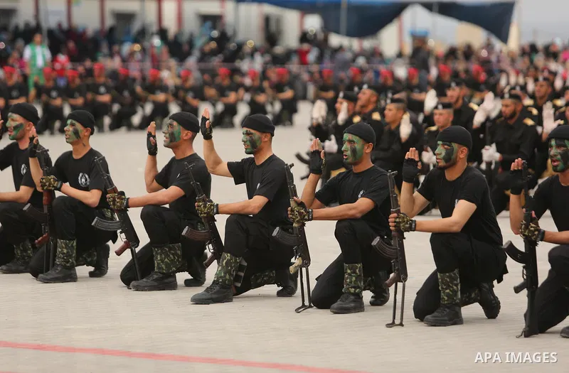 Palestinian police officers loyal to Hamas take part in a graduation ceremony in Gaza City March 30, 2017. Photo by Ashraf Amra