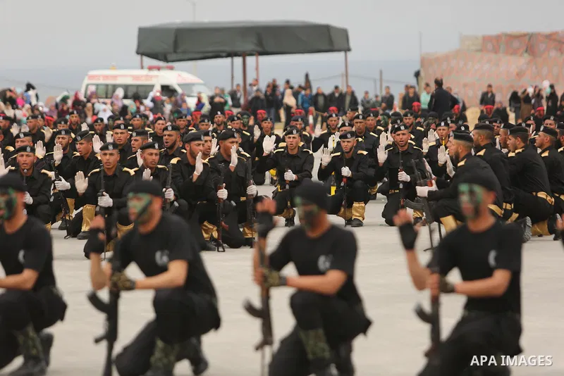 Palestinian police officers loyal to Hamas take part in a graduation ceremony in Gaza City March 30, 2017. Photo by Ashraf Amra