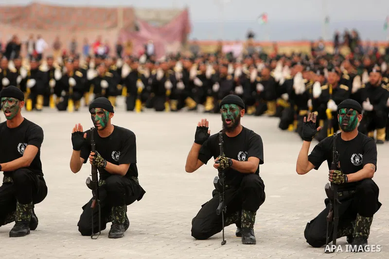 Palestinian police officers loyal to Hamas take part in a graduation ceremony in Gaza City March 30, 2017. Photo by Ashraf Amra