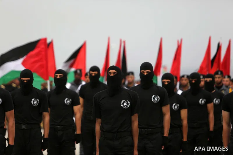 Palestinian police officers loyal to Hamas take part in a graduation ceremony in Gaza City March 30, 2017. Photo by Ashraf Amra
