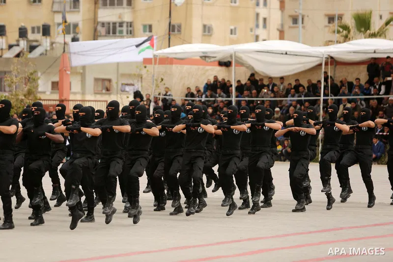 Palestinian police officers loyal to Hamas take part in a graduation ceremony in Gaza City March 30, 2017. Photo by Ashraf Amra