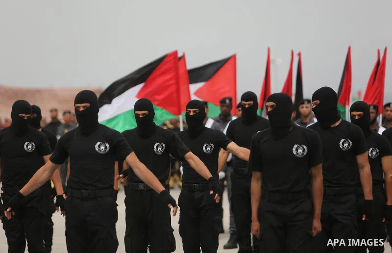 Palestinian police officers loyal to Hamas take part in a graduation ceremony in Gaza City March 30, 2017. Photo by Ashraf Amra