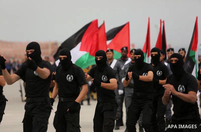 Palestinian police officers loyal to Hamas take part in a graduation ceremony in Gaza City March 30, 2017. Photo by Ashraf Amra